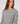 Langarmpullover mit Schößchen - Grau